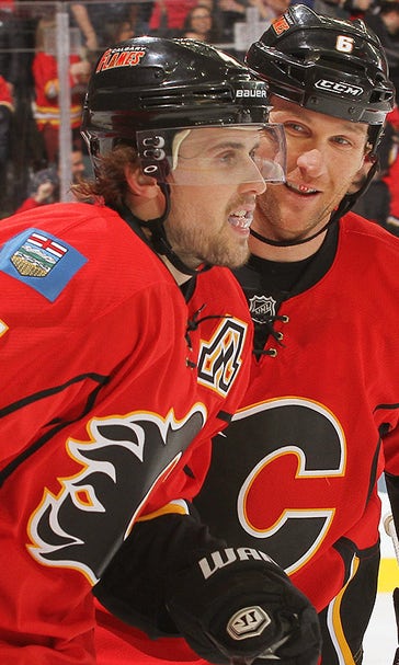 Russell's 1st goal, Hiller's 28 saves lead Flames past Sharks
